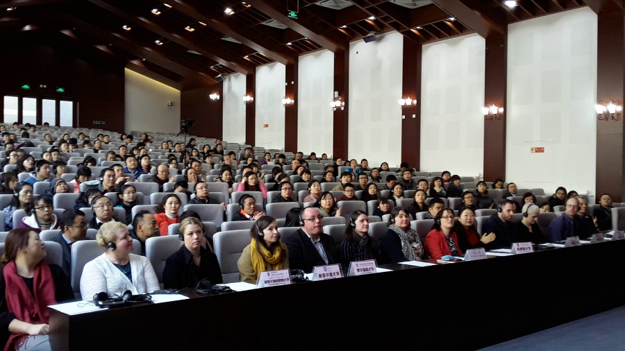 Students and parents listen to presentations
