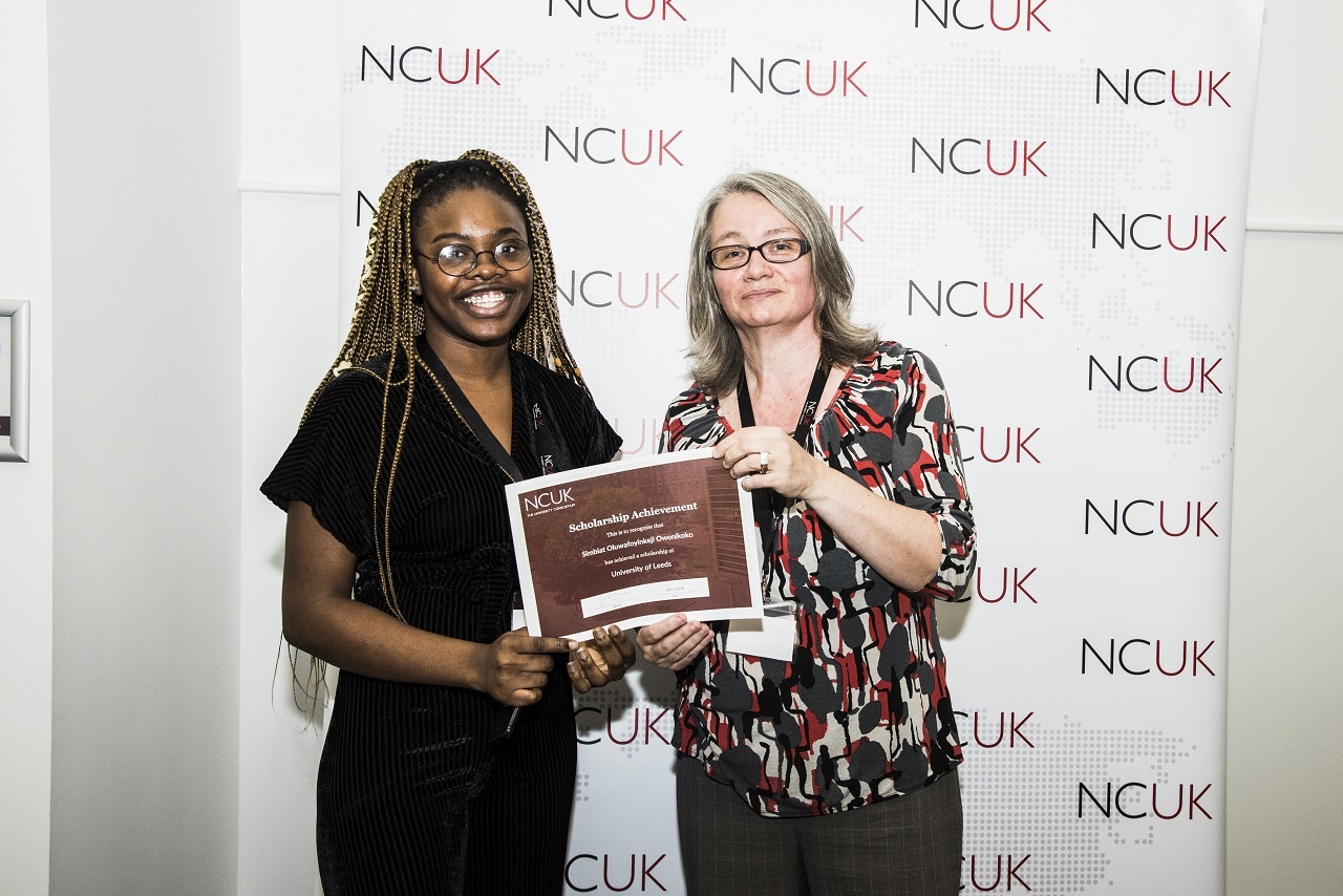 NCUK alumna, Simbiat Oluwafoyinkeji Owonikoko receiving her certificate from NCUK Academic Director, Emma Dawkins