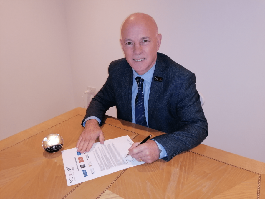 NCUK CEO signs partnership letter