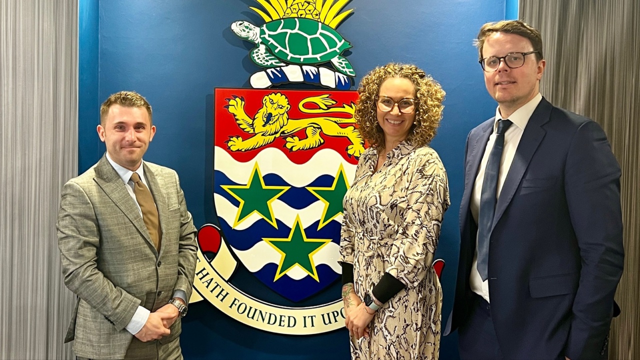 Brad Johnson and Stuart Smith with Dr Tasha Ebanks-Garcia, Representative for the Cayman Islands Government Office 