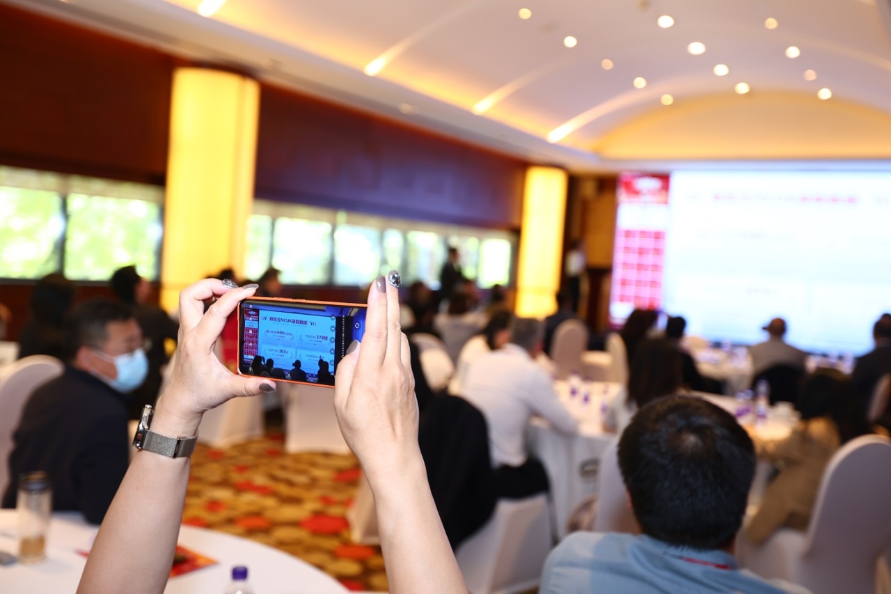 Attendees watching New Oriental Beijing's presentation.