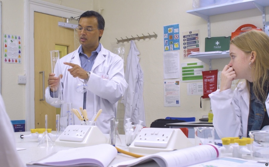 Teacher and students in a lab