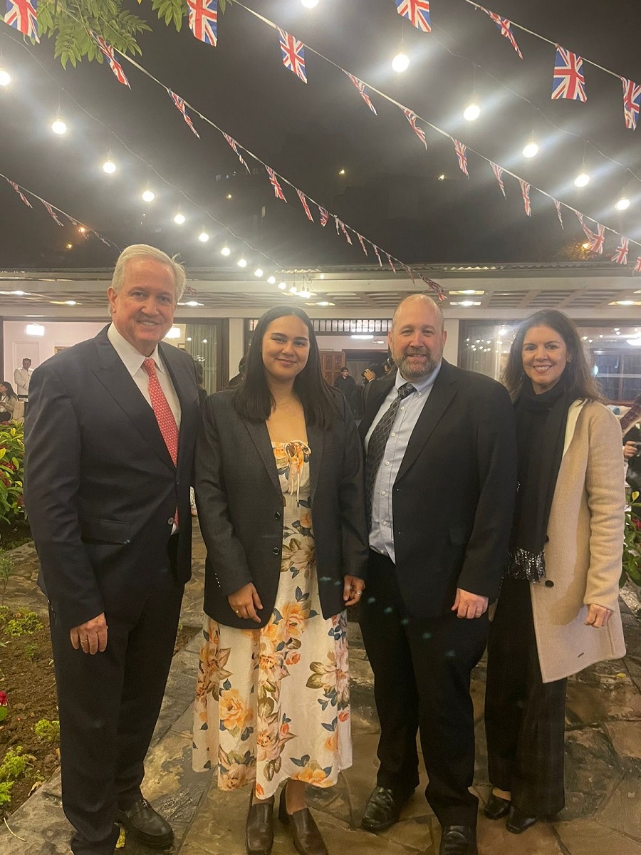 Staff and alumni at graduation event.